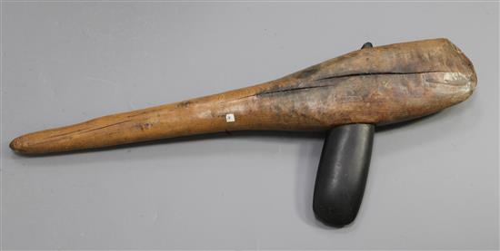An Obsidian hand axe mounted on a hardwood shaft, overall 71cm